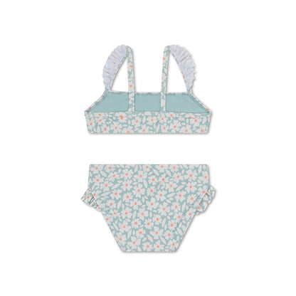 The back of a green bikini with floral pattern on a white background