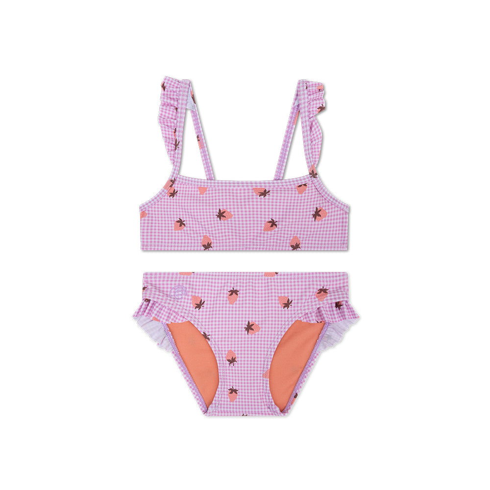 Bikini with pink checkered pattern and strawberries on it, with ruffles on a white background