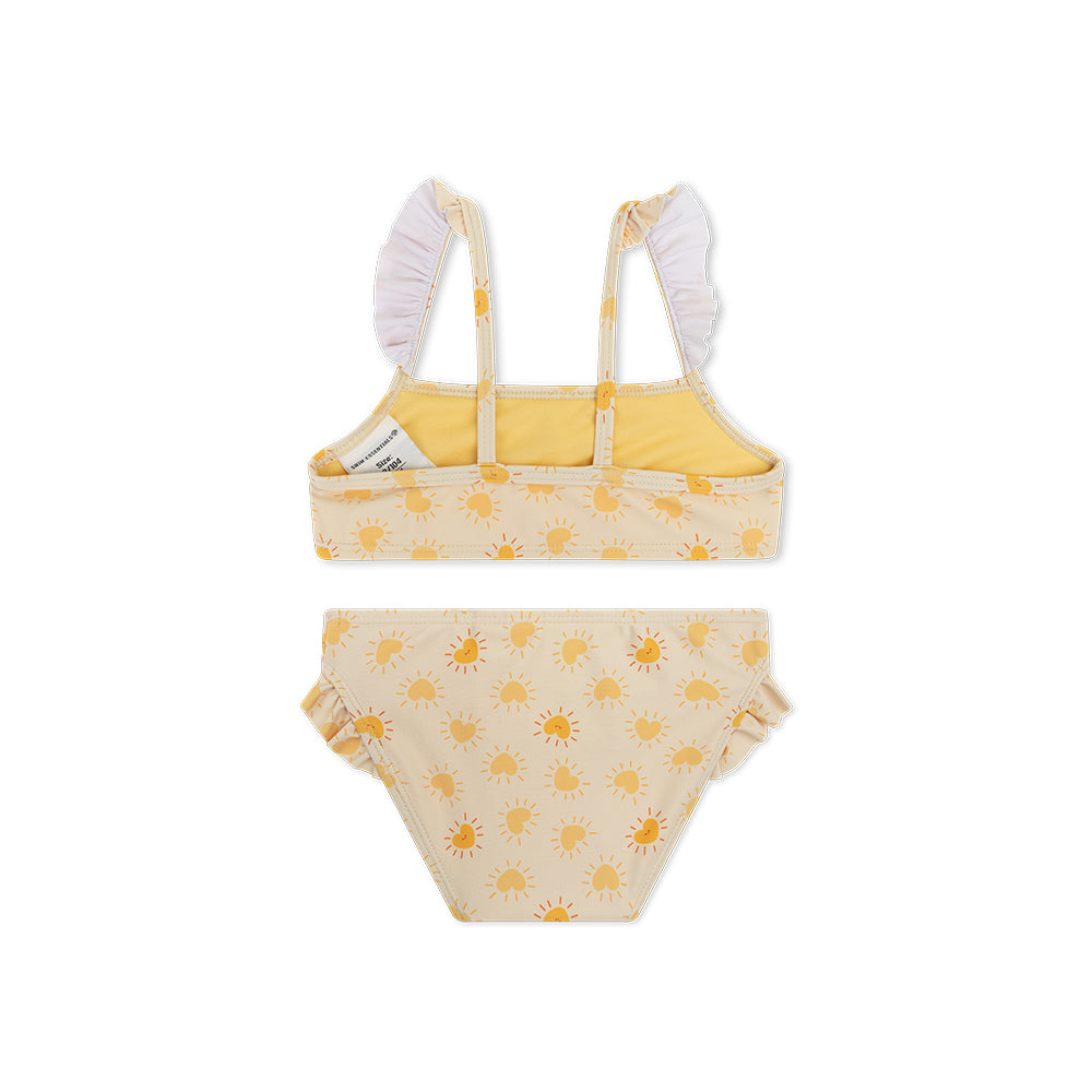 The back of a bikini with sun pattern on a white background