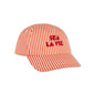 Red and white striped cap with 'Sea La Vie' text on it on a white background