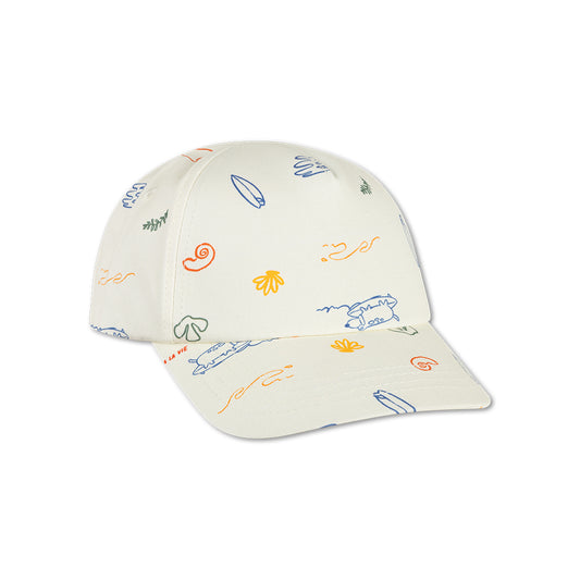 Beige cap with colorful sea patterns on a white background