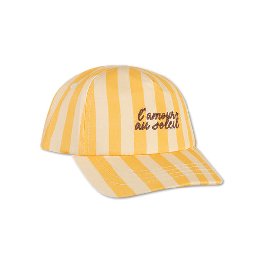 Yellow and beige striped cap with "L'amour au Soleil" text on it on a white background