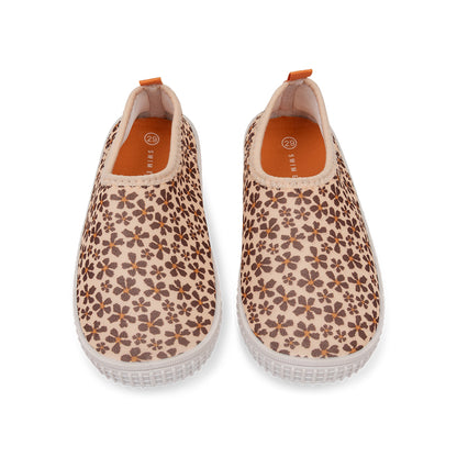 Pair of wild floral-patterned water shoes on a white background