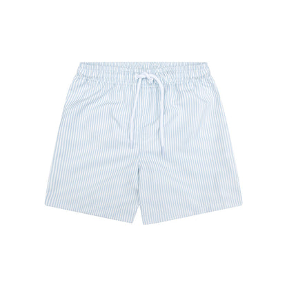 Light blue and white striped swim shorts on a white background