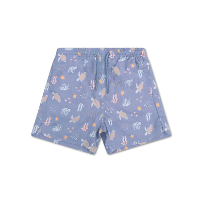 Blue shorts with sea turtle and coral pattern on a white background