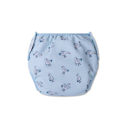 The back of a blue swim diaper with seagull pattern on a white background