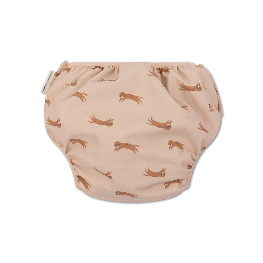 The back of beige swim diaper with animal pattern on a white background