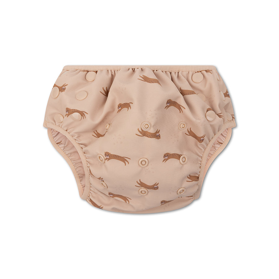 Beige swim diaper with animal pattern on a white background