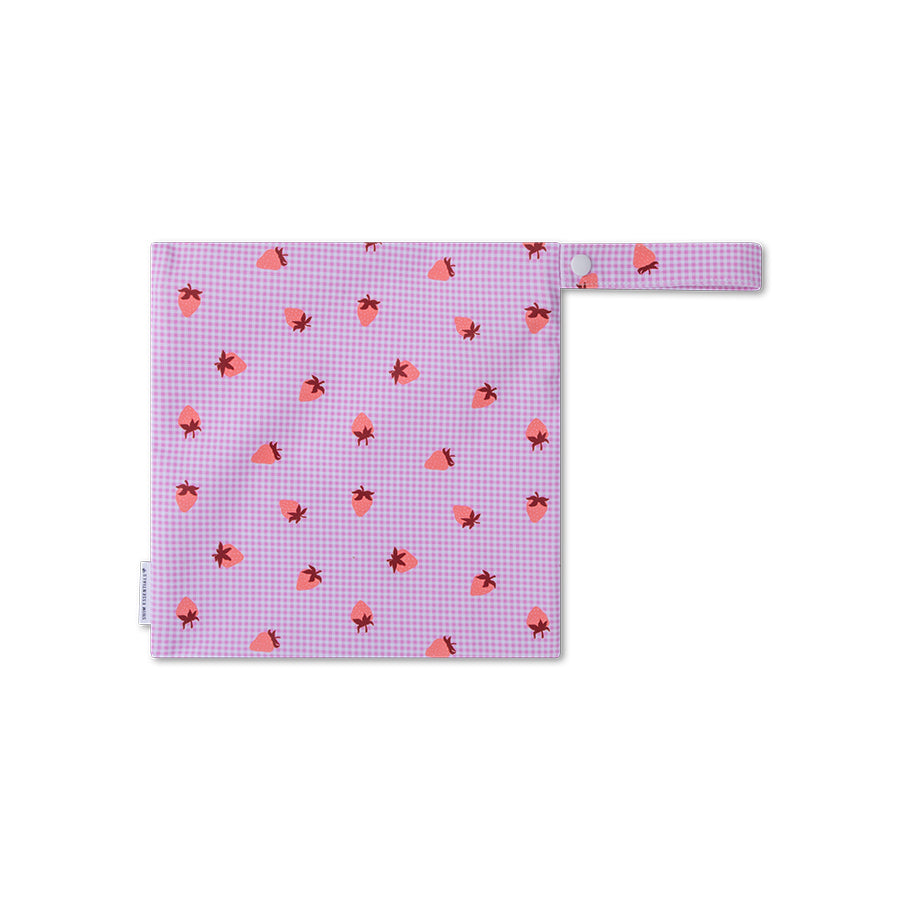 A small pink checkered bag with red heart patterns on a white background