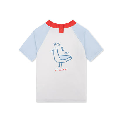 Children's t-shirt with a seagull design and 'Seas the Day' text on a white background