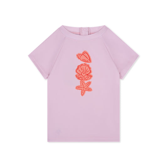 Pink t-shirt short-sleeve with orange shell designs on a white background