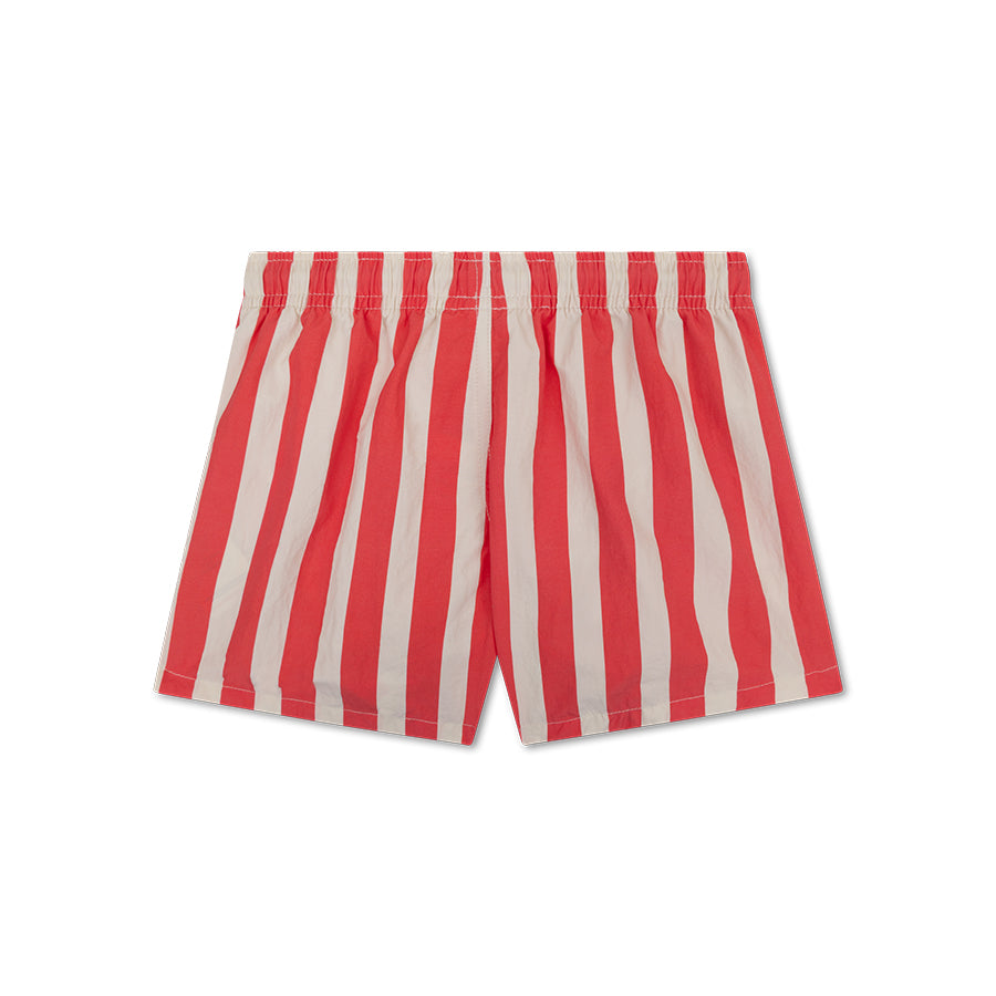 The back of red and white striped swim shorts on a white background