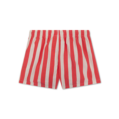 The back of red and white striped swim shorts on a white background