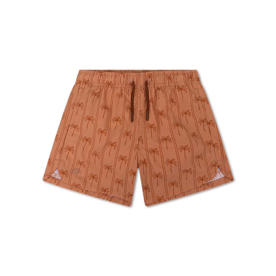Brown swim shorts with palm tree pattern on a white background