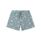 Green and white striped swim shorts with animal pattern on a white background