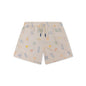 Beige swim shorts with colorful patterns on a white background