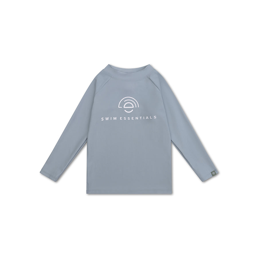 Blue  long-sleeve swimming shirt with white 'Swim Essentials' logo on a white background