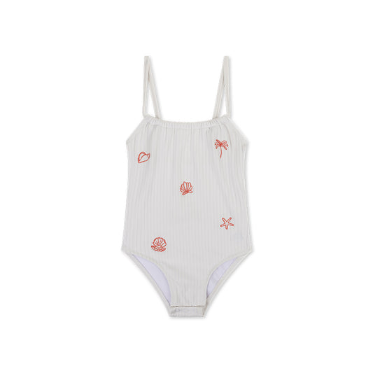 White Pearl swimsuit with red shell and palm tree patterns on a white background