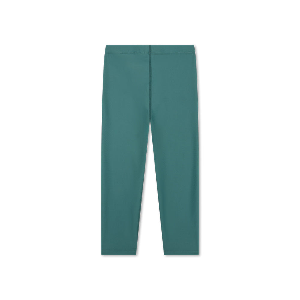 The back of a green UV legging on a white background