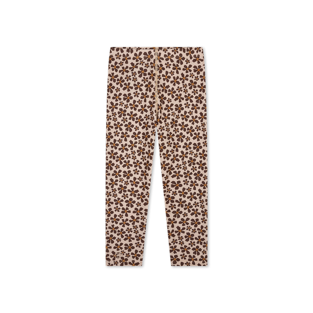 The back of an UV Legging with brown and orange wild flower pattern on a white background