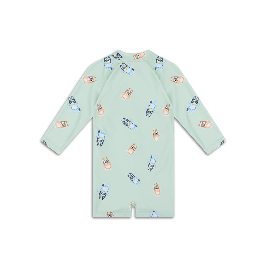 Light green long sleeve Bluey children swimsuit with cartoon dog print on a white background