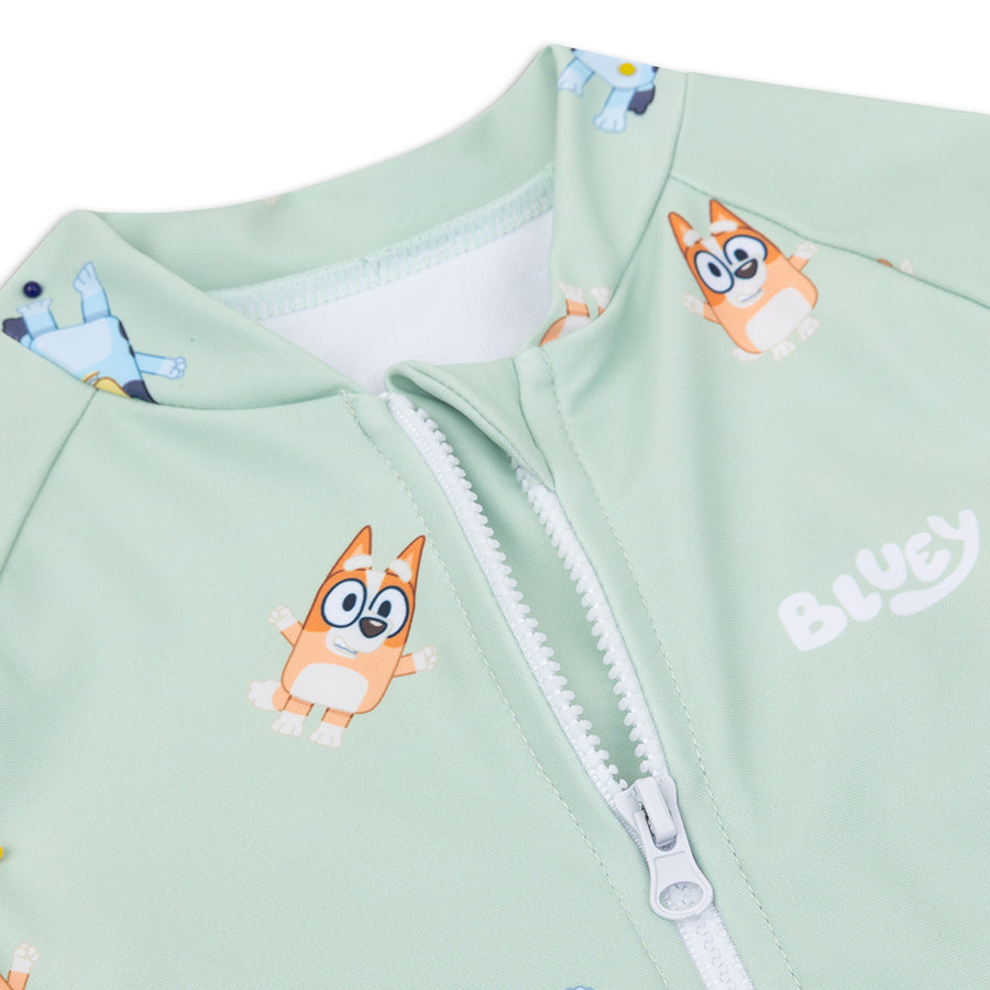 Light green children swimsuit Bluey with cartoon dog design and white zipper detail