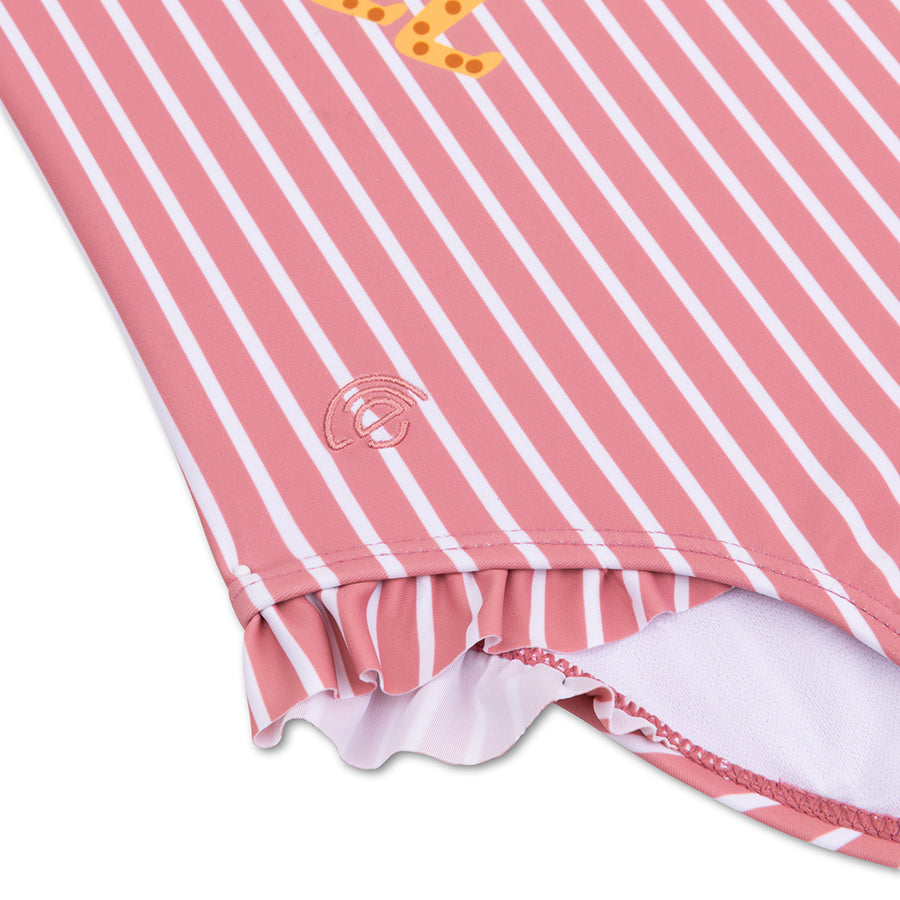 Close-up of a pink and white striped garment with a brand logo on a white background