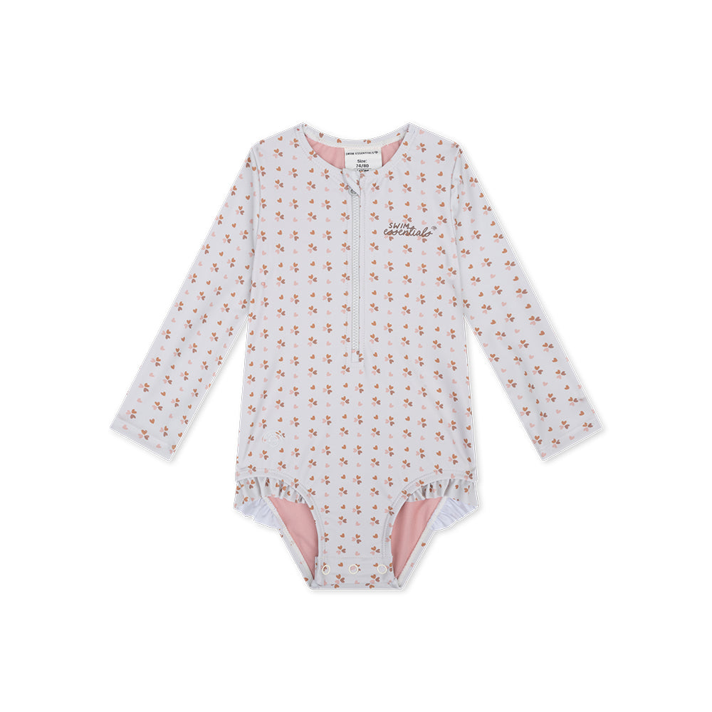 Children's long-sleeve swimsuit and a zip in the middle with little hearts pattern on a white background