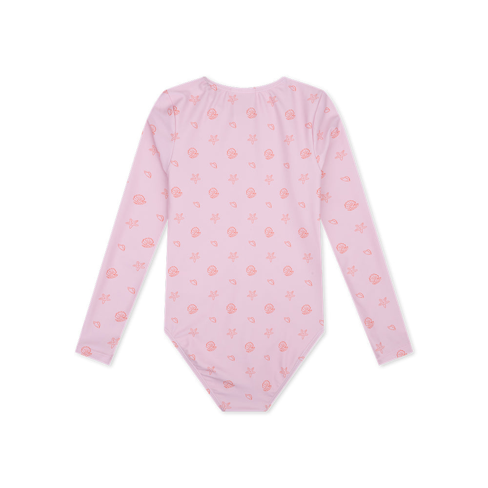 Pink long-sleeve swimsuit Shell Tastic with small orange shell patterns on a white background